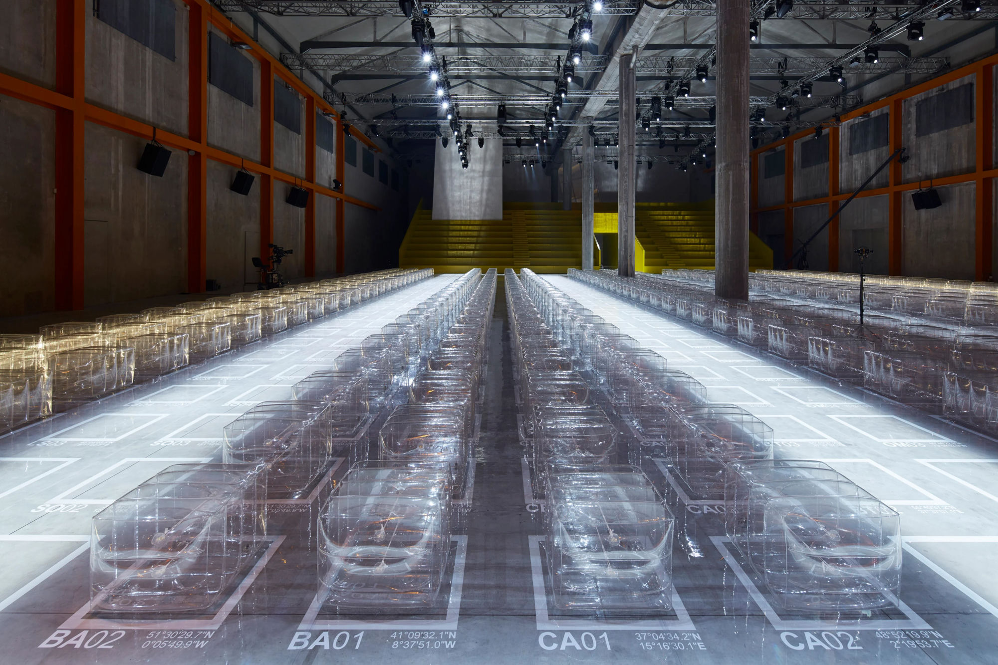 Prada Spring/Summer 2019 menswear show, Milan: a grid of Verner Panton's transparent inflatable stools, set designed by AMO.